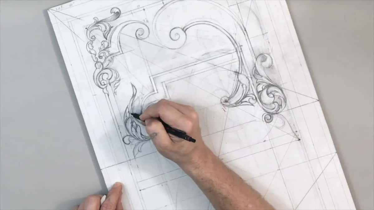 Sheet turned on its corner, one hand drawing a long leaf at the left while the other holds the edge
