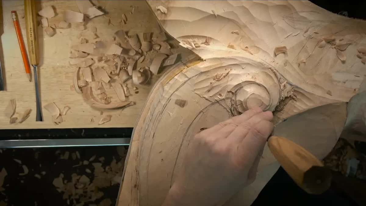 Fist around a long handled gouge at the spiral
