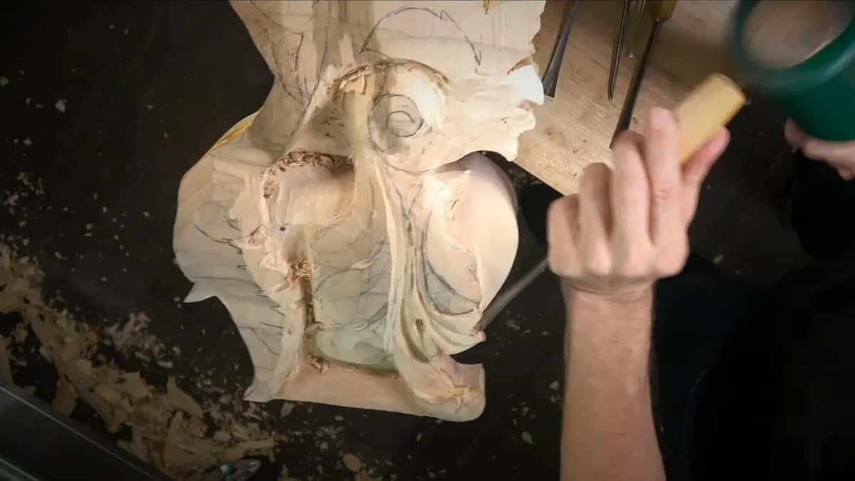 Mallet driving a gouge