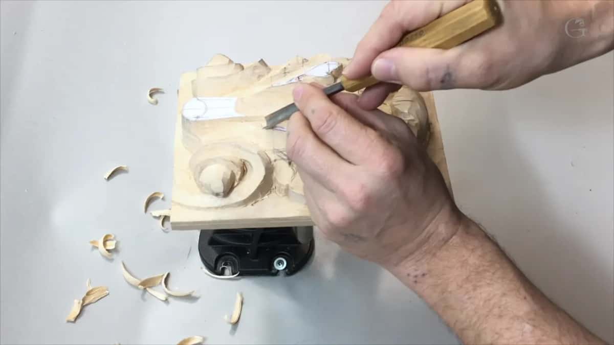 Board on its side over the round vise base
