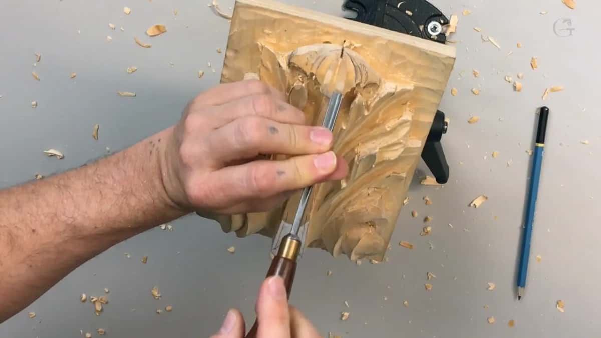 Blue pencil on the table at right, a dark handle and steel blade in the middle of the leaf