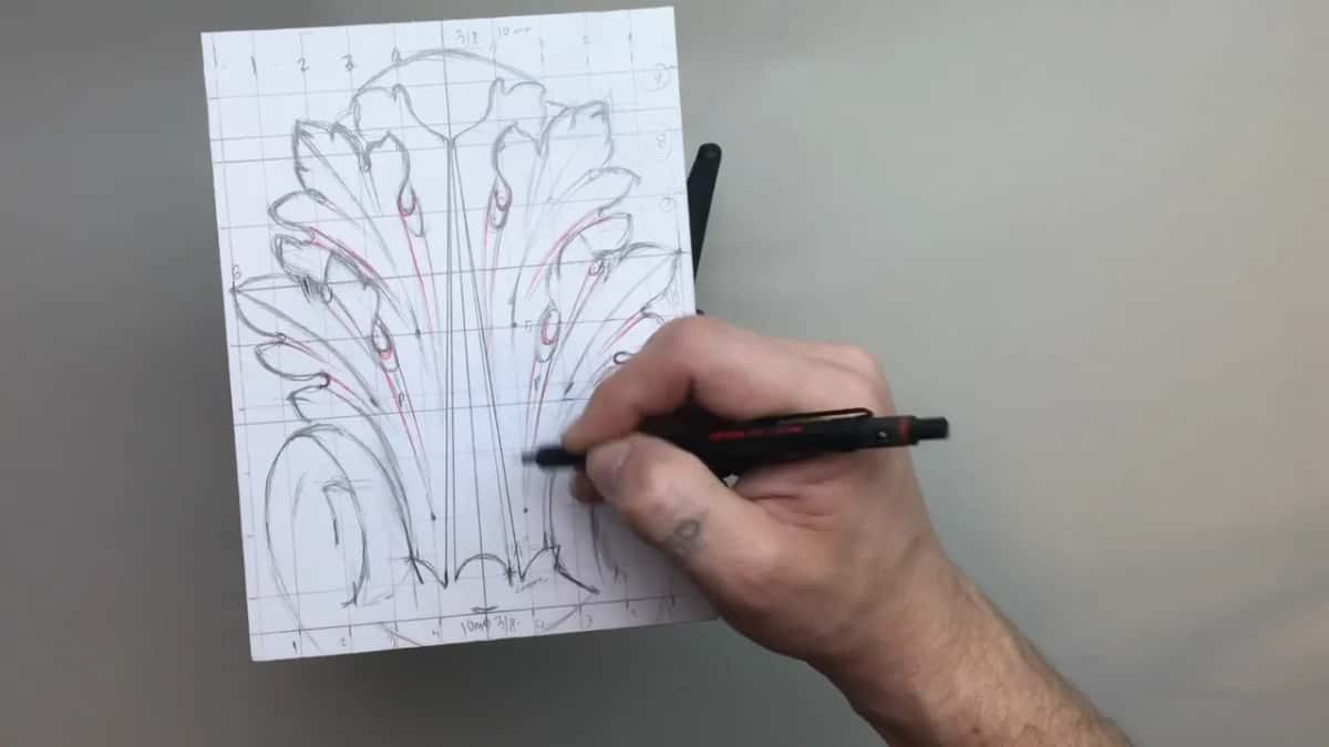 Left volute drawn in, the pen working just right of the centre stems