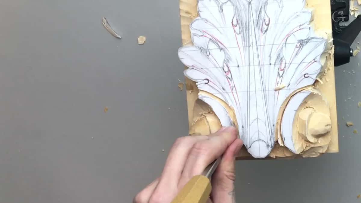 Both volutes roughed out, a light handled gouge at the tip of the leaf