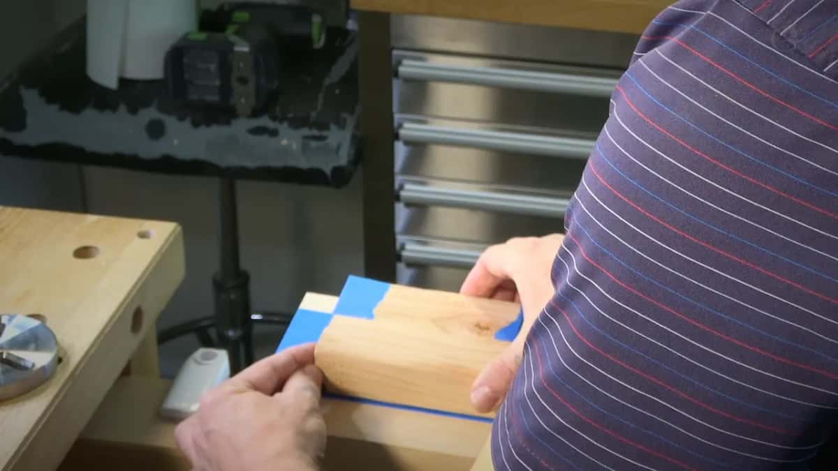 Pressing the taped blank down