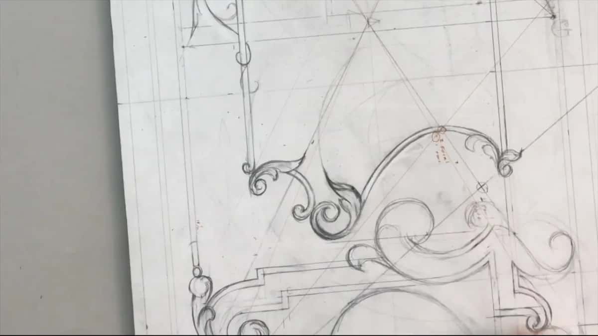Upright drawing with an S scroll across its middle and more curves and a stepped molding below it