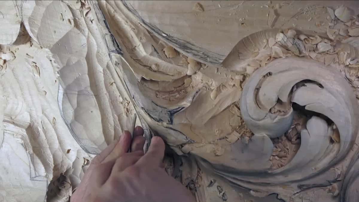Fingers guide a short pass by the leaf edge.