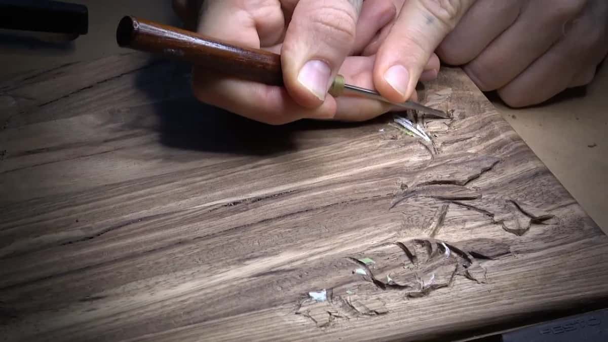 Slim tool with a brass ferrule, lowering the leaf below its twist.