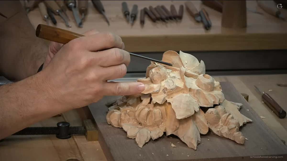 Low side view, a thin blade over the carving