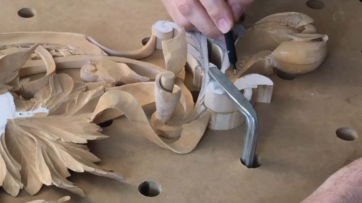 Hex clamp beside the curl, and a black-handled tool going into it