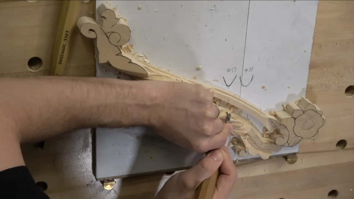 Arm across the board, and a handle stamped Swiss Made 11/7 lying at the left edge.
