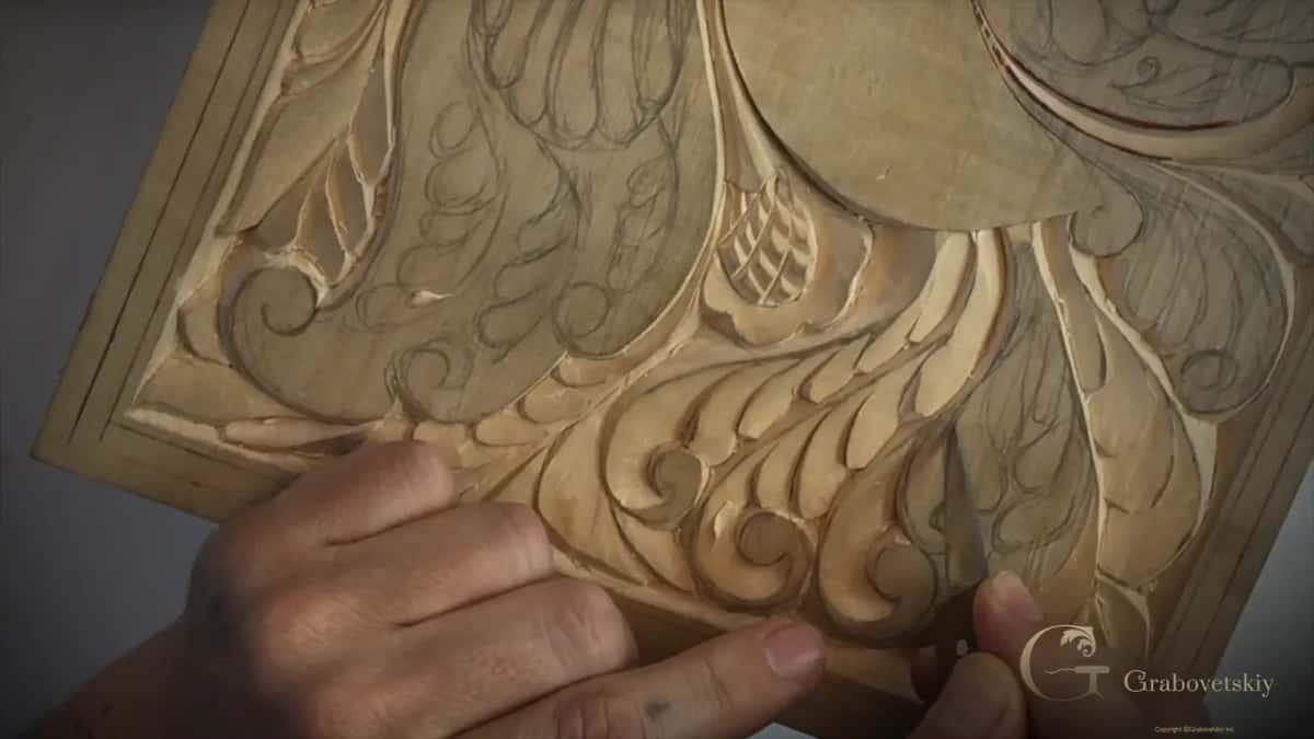 Knife held upright among the bottom curls