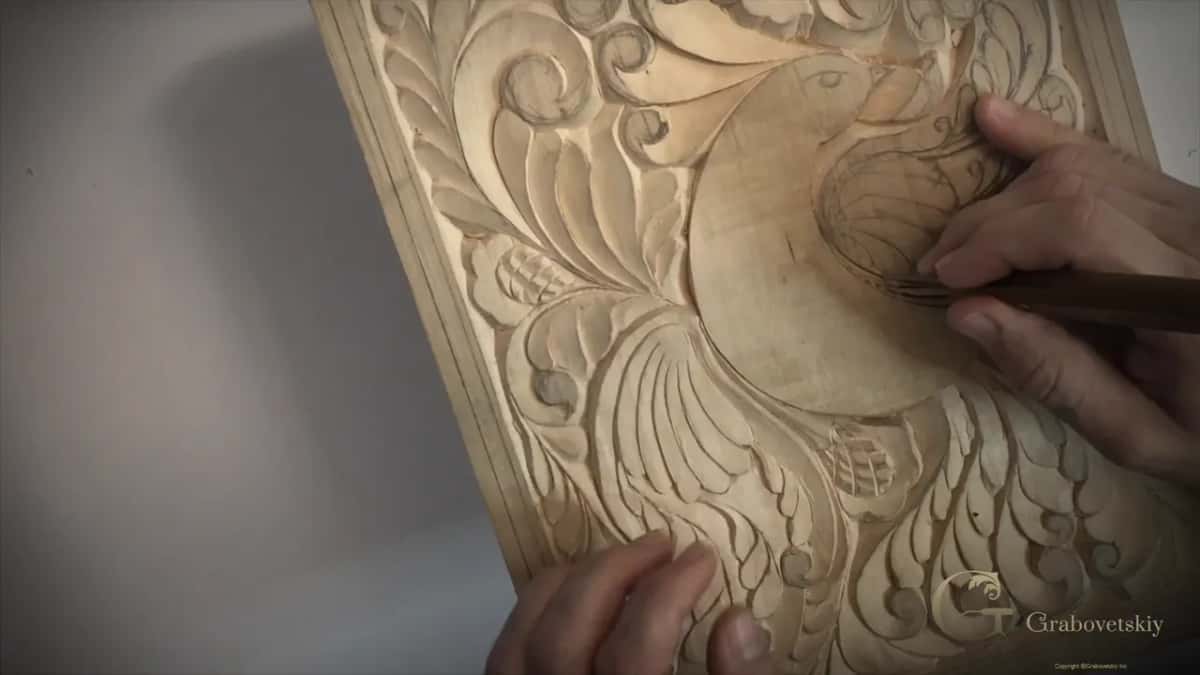 Knife low at the bottom of the wing, my other fingers on the lower edge of the board