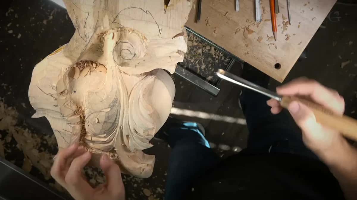 Palm on the handle, left hand steadying