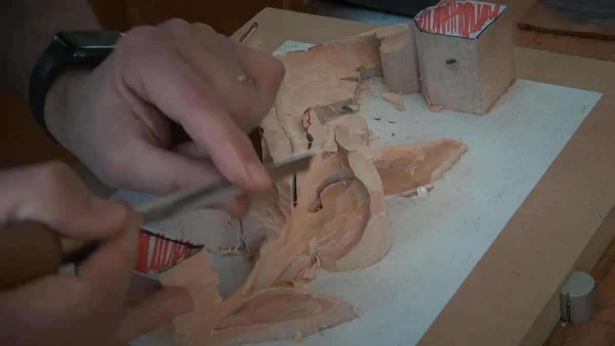 Two hands, one gouge