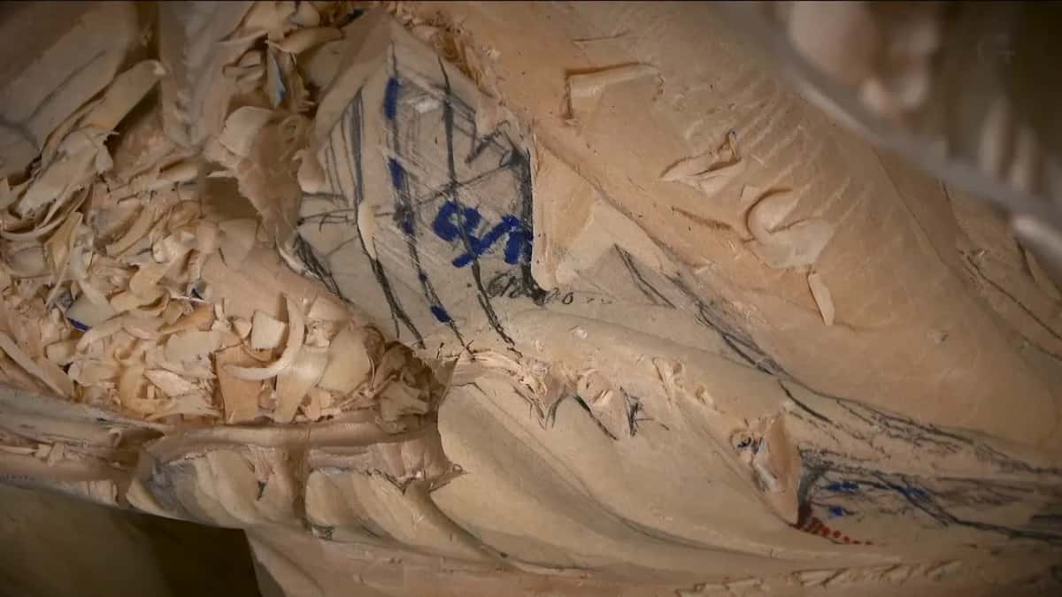 Marks on the leaf Marker letters and gray pencil lines crossing a leaf, shavings heaped along the whole left edge