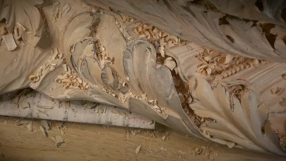 Raking light Raking light across carved leaves, curled shavings on the panel and on the bench under it