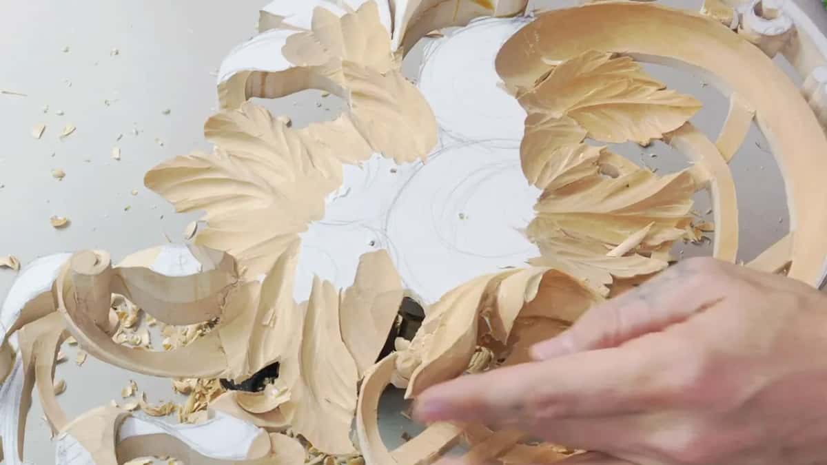 Fingertips on a curled leaf
