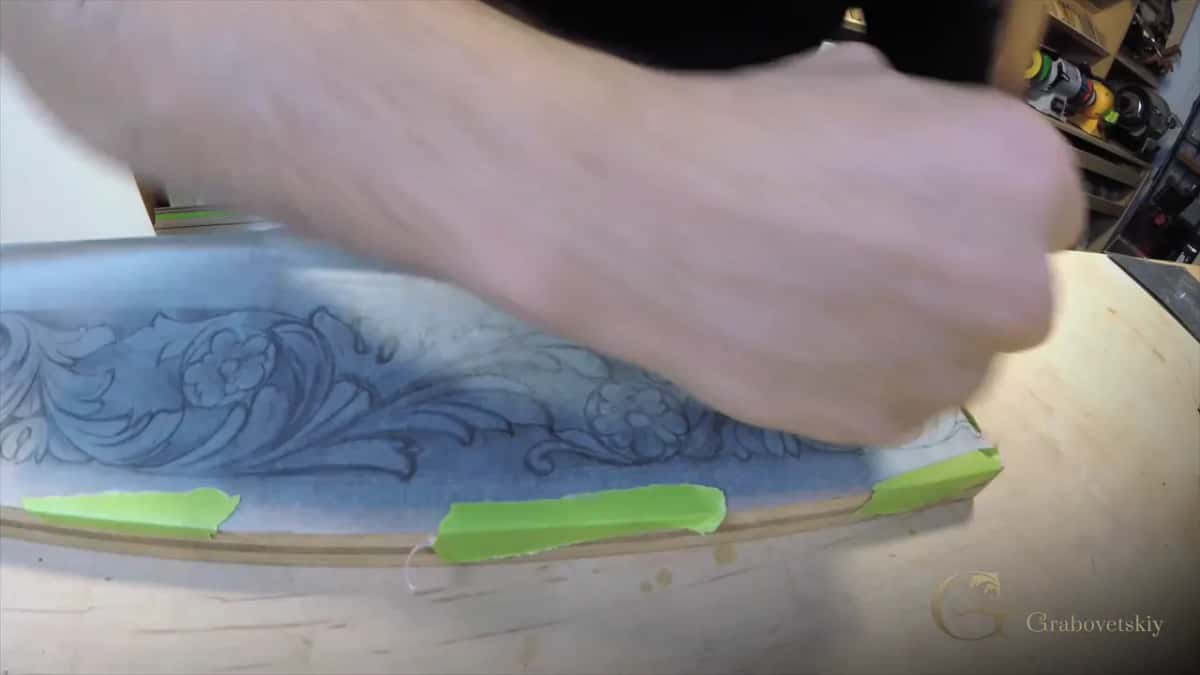 Carbon tracing taped down in green