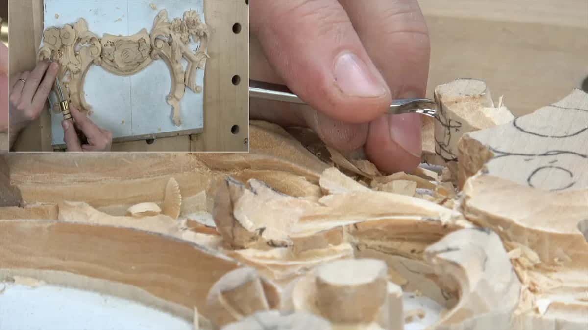 Small gouge in the fingers at a rounded scroll above round stubs, the panel inset at left