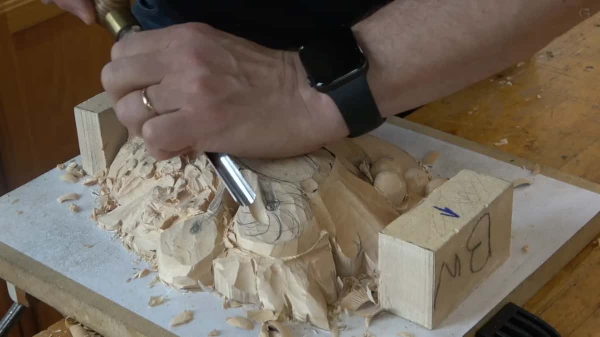 Chips piling up while a gouge digs beside the form