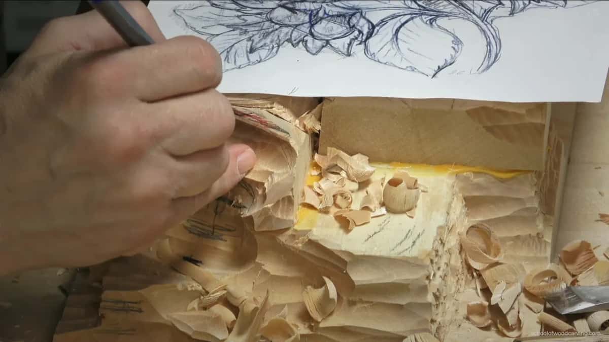 Pen held above the paper pattern