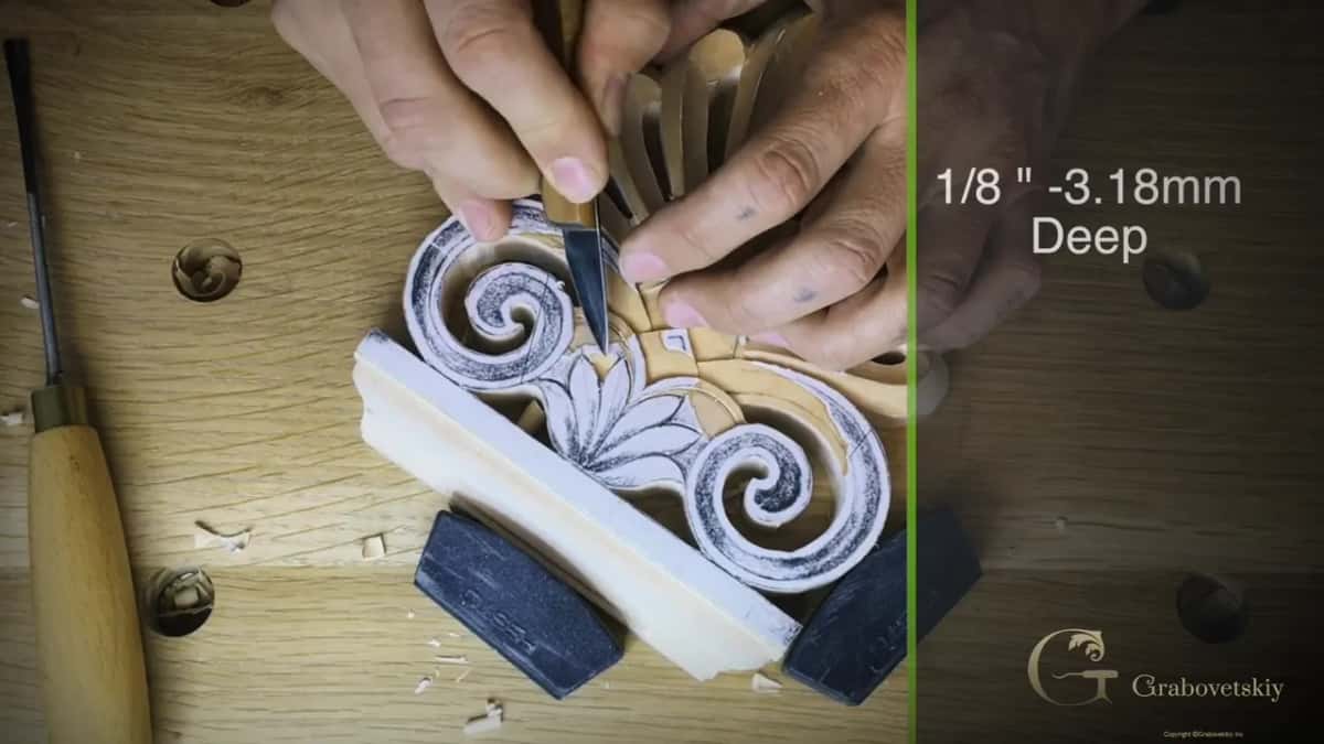 A card on screen reads 1/8 inch, 3.18 mm deep, as the knife lowers the ground near a scroll