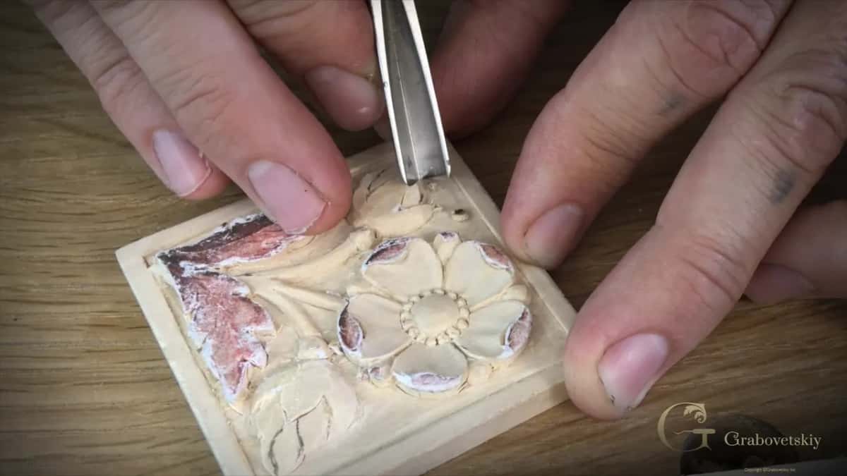 Upright V tool over a flower