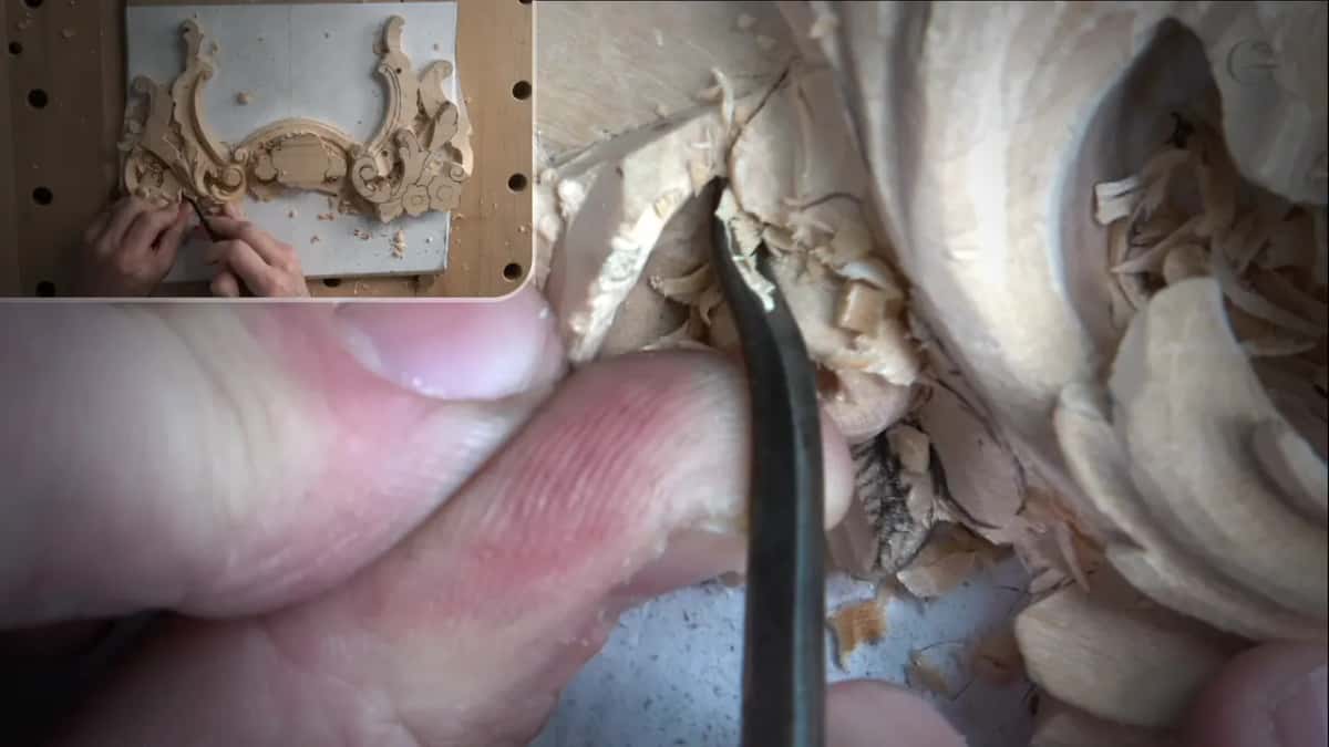 Fingers pinch a short tool into a petal