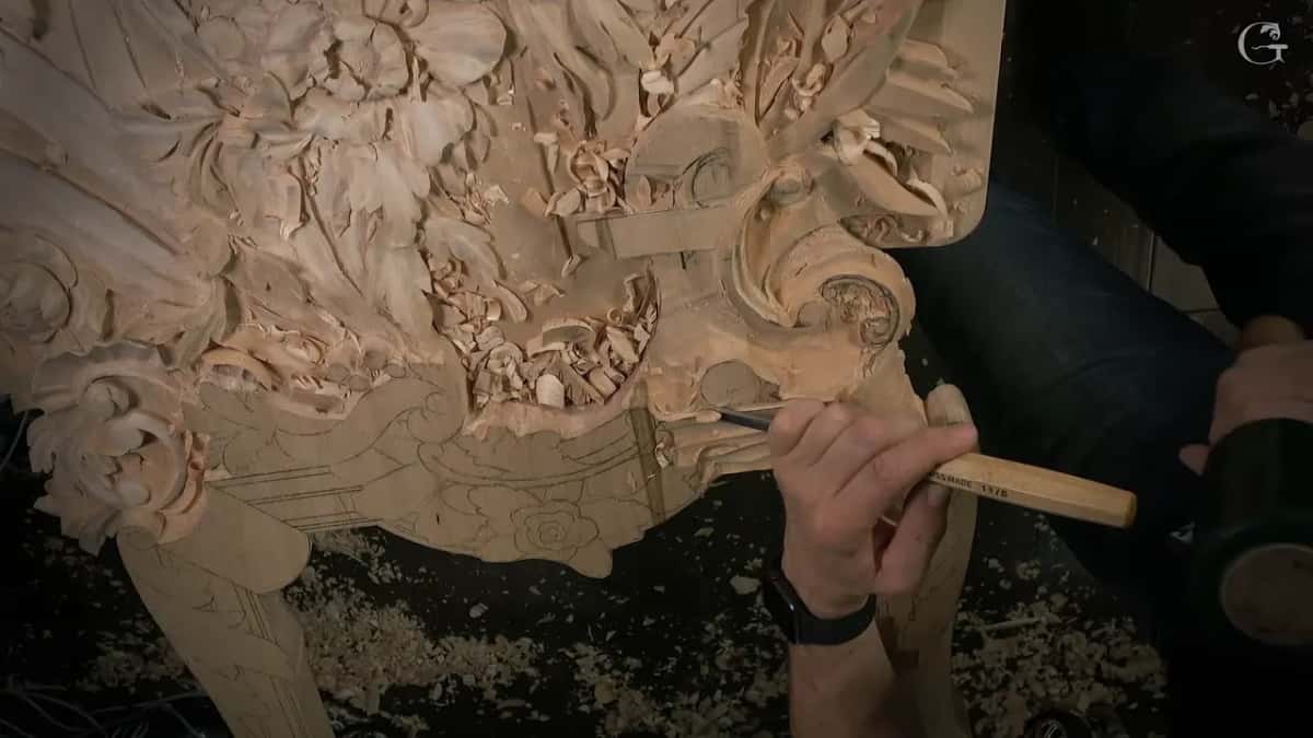 The whole panel from above, a thin tool held low at its right edge