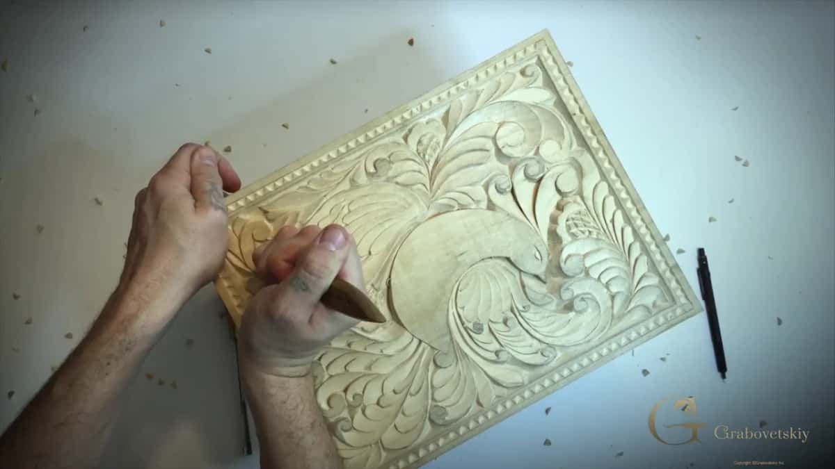 Knife low at the left of the bird, scalloped border along the top, a pencil on the bench
